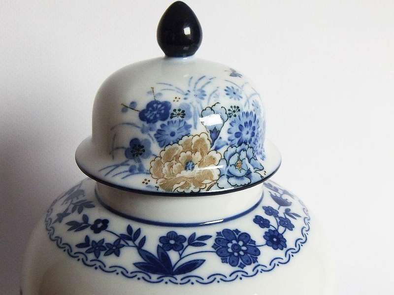 A vintage Japanese Genuine Imperial Imari porcelain lidded jar with child and floral motif