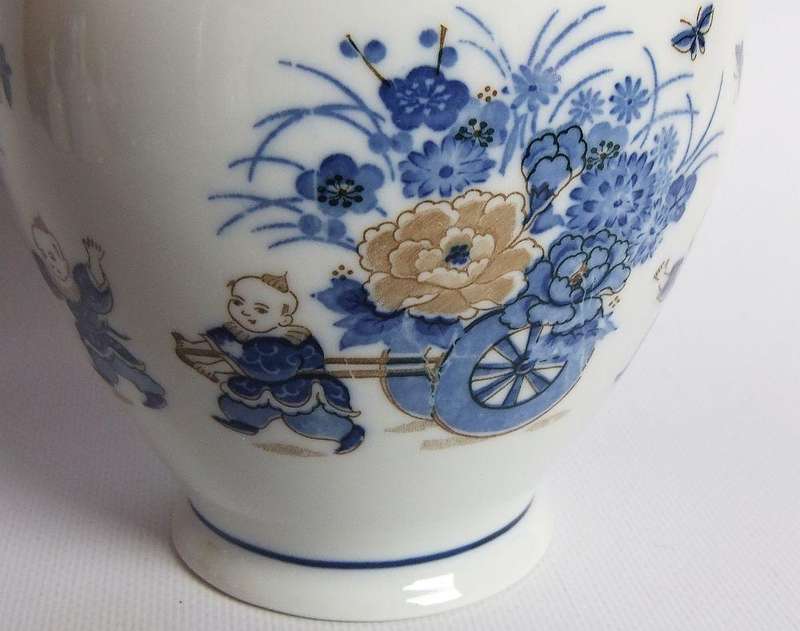 A vintage Japanese Genuine Imperial Imari porcelain lidded jar with child and floral motif