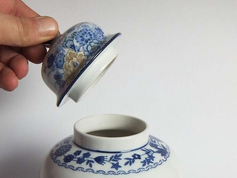 A vintage Japanese Genuine Imperial Imari porcelain lidded jar with child and floral motif