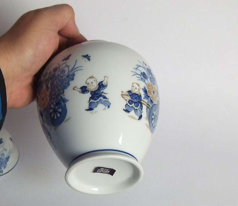 A vintage Japanese Genuine Imperial Imari porcelain lidded jar with child and floral motif