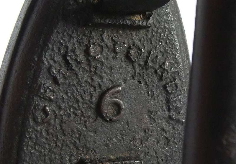 An antique coal stove iron or doorstop
