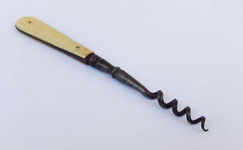 A rare Victorian perfume bottle corkscrew with bone handle