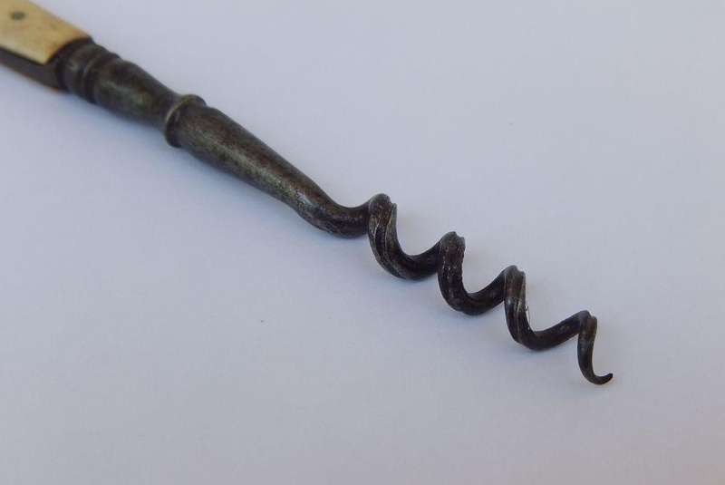 A rare Victorian perfume bottle corkscrew with bone handle