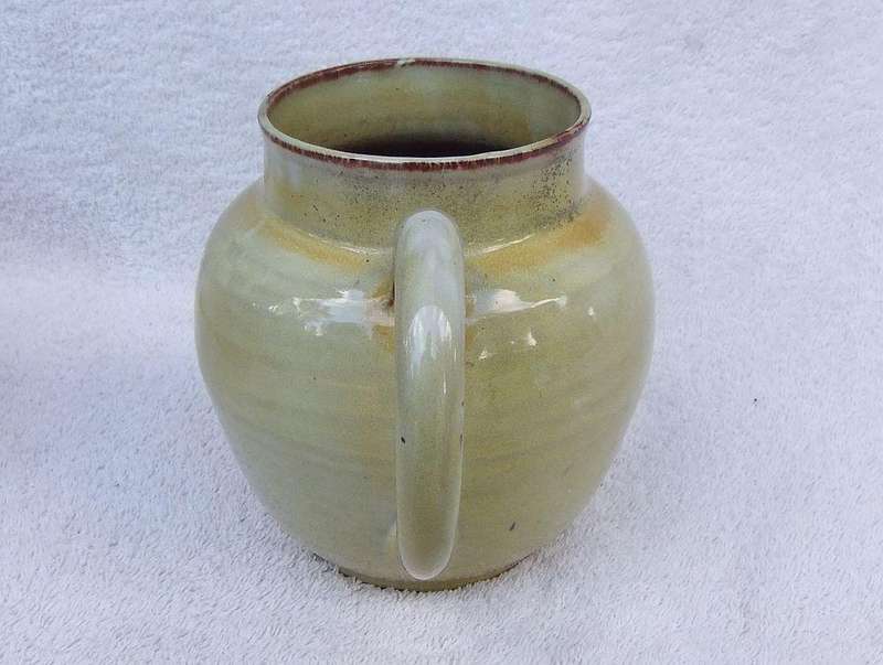 A vintage pottery ewer in the style of Globe or Linn ware pottery