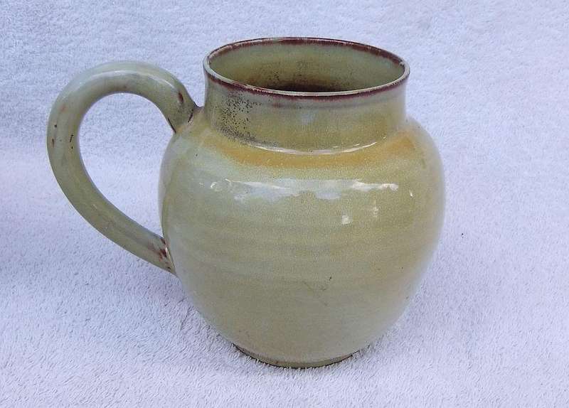 A vintage pottery ewer in the style of Globe or Linn ware pottery