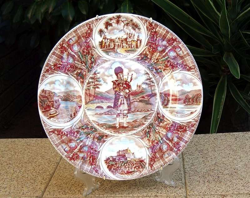 A vintage porcelain display plate by Weatherby depicting scenes of Scotland