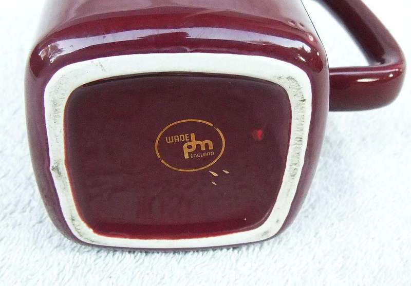 A vintage Dunhill advertising water jug by Wade England