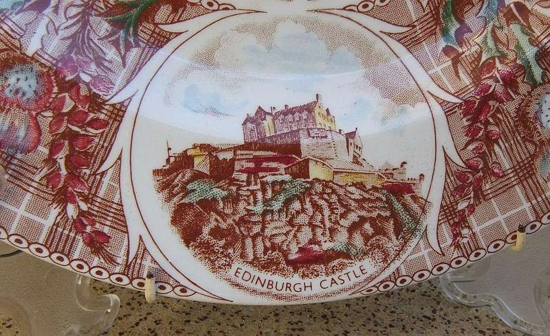 A vintage porcelain display plate by Weatherby depicting scenes of Scotland