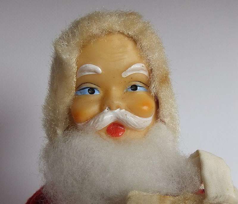 A vintage tinplate and material wind up Santa figure