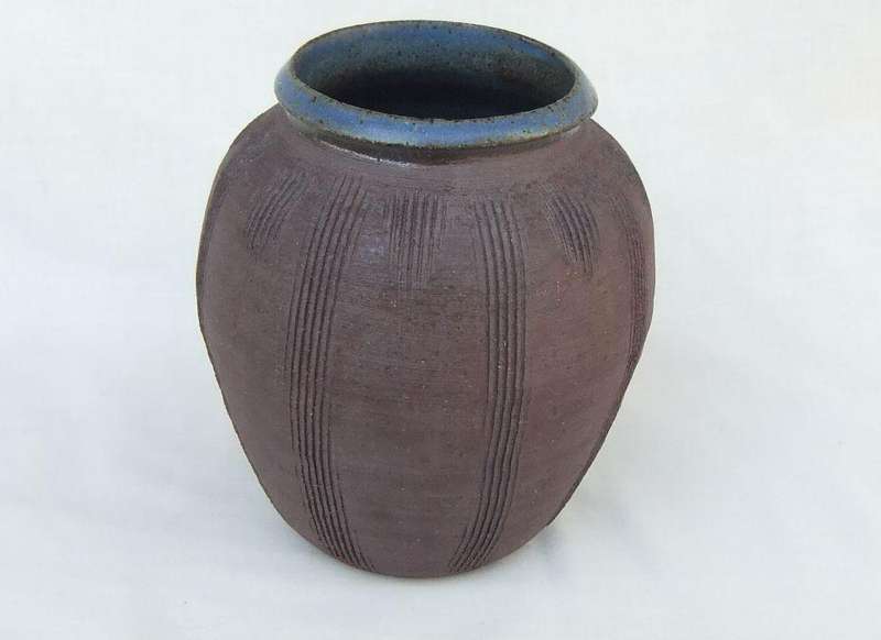 A vintage pottery vase with makers stamp on the base