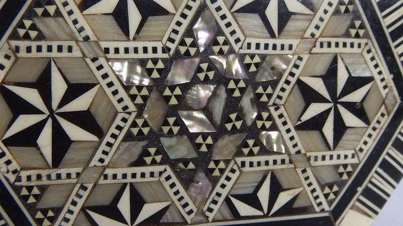 A vintage six sided hand made jewelry box with mother of pearl and bone inlay