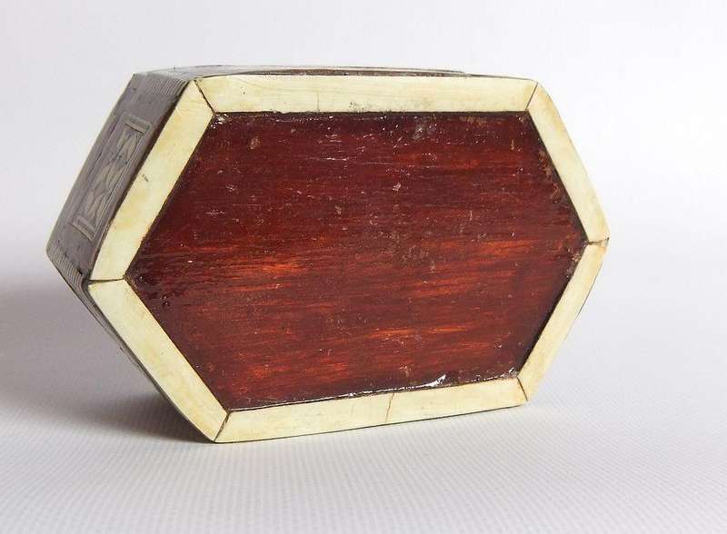 A vintage six sided hand made jewelry box with mother of pearl and bone inlay
