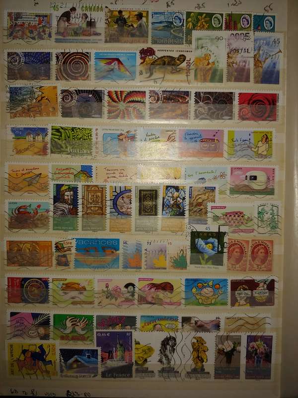 USED A4 STOCKBOOK 16/32 PAGES LOADED WITH WORLD STAMPS WRITING ON PAGES STAMPS GOOD VALUE
