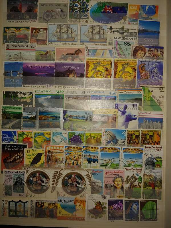 USED A4 STOCKBOOK 16/32 PAGES LOADED WITH WORLD STAMPS WRITING ON PAGES STAMPS GOOD VALUE