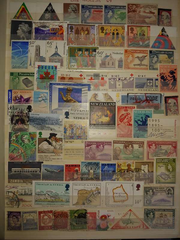 USED A4 STOCKBOOK 16/32 PAGES LOADED WITH WORLD STAMPS WRITING ON PAGES STAMPS GOOD VALUE