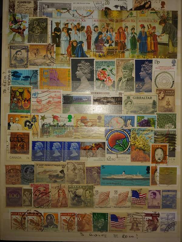 USED A4 STOCKBOOK 16/32 PAGES LOADED WITH WORLD STAMPS WRITING ON PAGES STAMPS GOOD VALUE