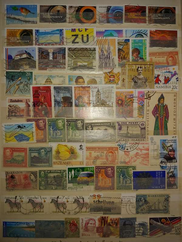 USED A4 STOCKBOOK 16/32 PAGES LOADED WITH WORLD STAMPS WRITING ON PAGES STAMPS GOOD VALUE