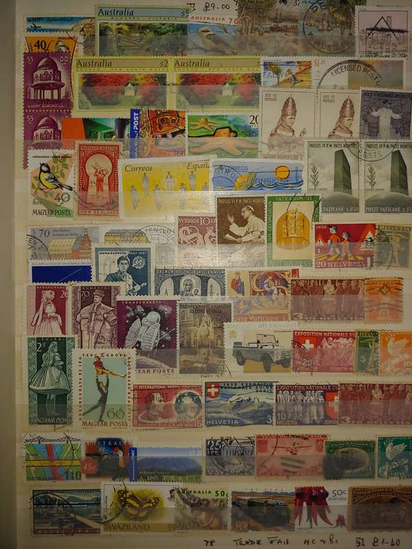 USED A4 STOCKBOOK 16/32 PAGES LOADED WITH WORLD STAMPS WRITING ON PAGES STAMPS GOOD VALUE