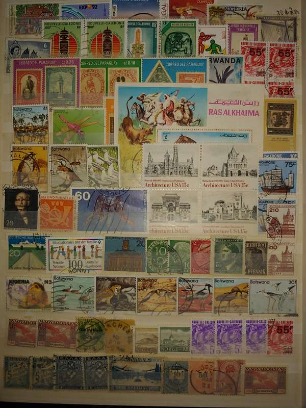 USED A4 STOCKBOOK 16/32 PAGES LOADED WITH WORLD STAMPS WRITING ON PAGES STAMPS GOOD VALUE