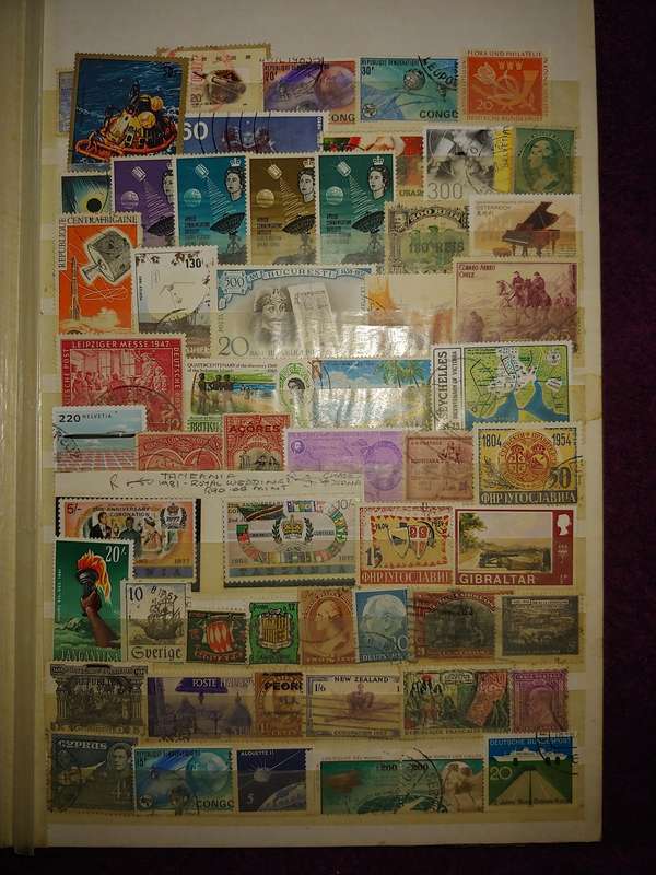 USED A4 STOCKBOOK 16/32 PAGES LOADED WITH WORLD STAMPS WRITING ON PAGES STAMPS GOOD VALUE