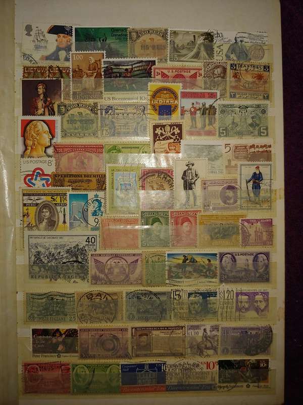 USED A4 STOCKBOOK 16/32 PAGES LOADED WITH WORLD STAMPS WRITING ON PAGES STAMPS GOOD VALUE