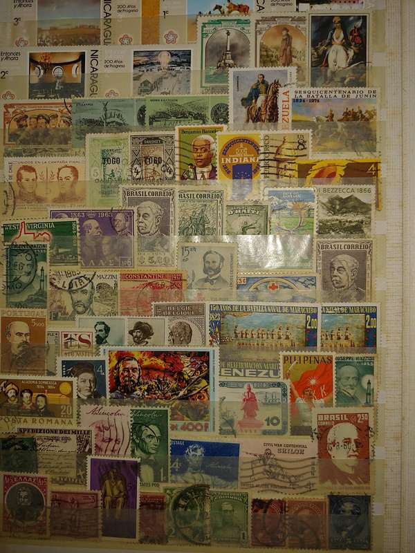 USED A4 STOCKBOOK 16/32 PAGES LOADED WITH WORLD STAMPS WRITING ON PAGES STAMPS GOOD VALUE