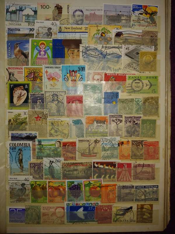 USED A4 STOCKBOOK 16/32 PAGES LOADED WITH WORLD STAMPS WRITING ON PAGES STAMPS GOOD VALUE