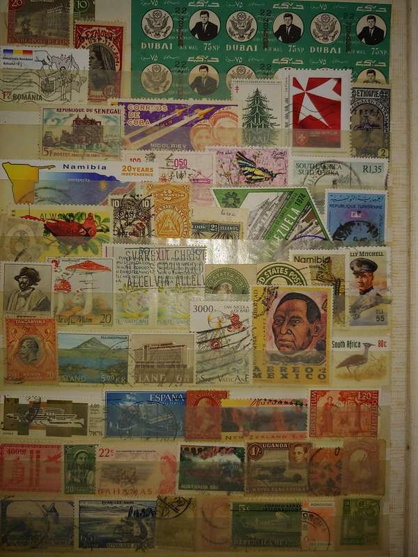 USED A4 STOCKBOOK 16/32 PAGES LOADED WITH WORLD STAMPS WRITING ON PAGES STAMPS GOOD VALUE