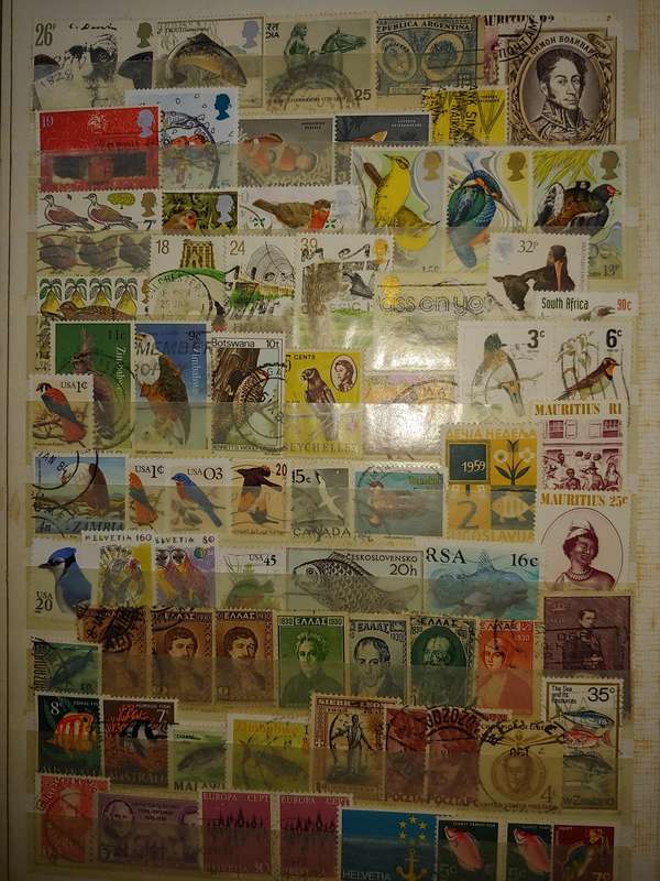 USED A4 STOCKBOOK 16/32 PAGES LOADED WITH WORLD STAMPS WRITING ON PAGES STAMPS GOOD VALUE