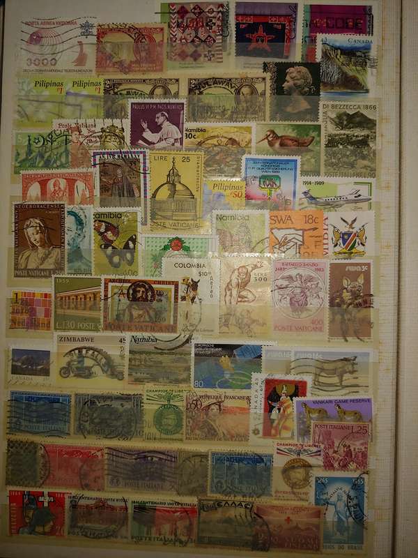 USED A4 STOCKBOOK 16/32 PAGES LOADED WITH WORLD STAMPS WRITING ON PAGES STAMPS GOOD VALUE