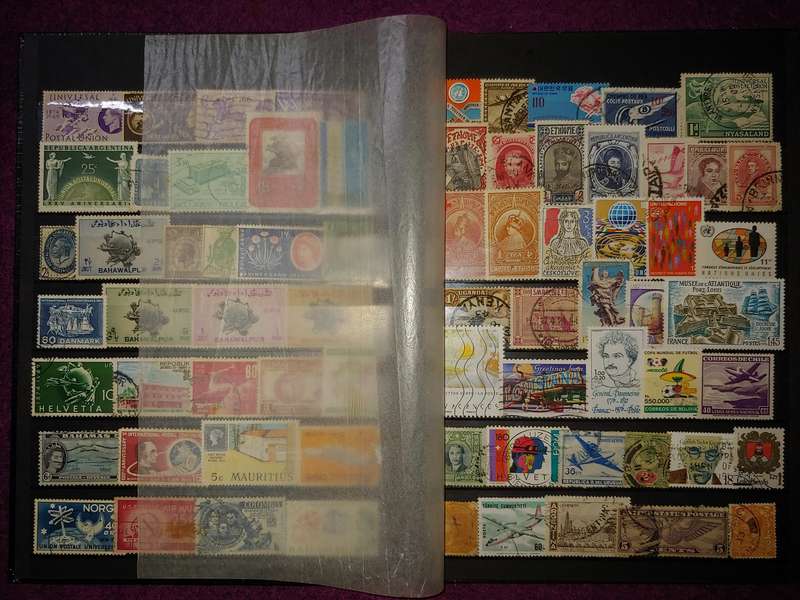 A5 STOCKBOOK LOADED WITH STAMPS AS PER IMAGES 4/8 PAGES