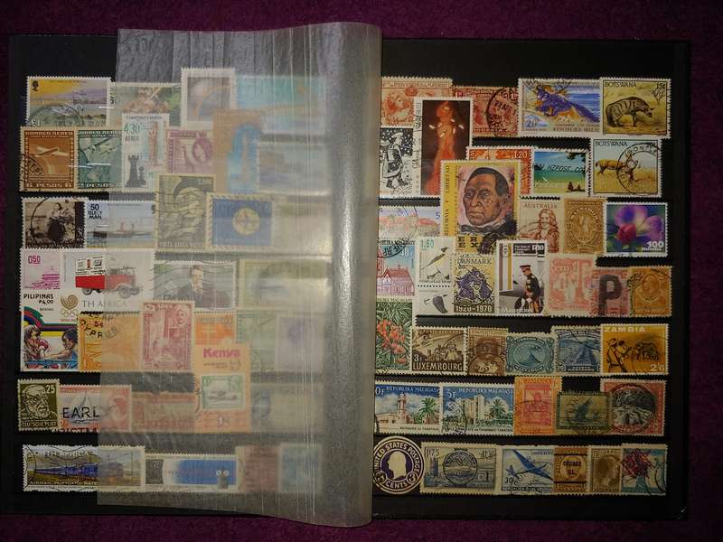 A5 STOCKBOOK LOADED WITH STAMPS AS PER IMAGES 4/8 PAGES