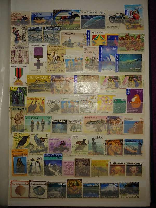 USED A4 STOCKBOOK 11/22 PAGES LOADED WITH WORLD STAMPS GOOD VALUE