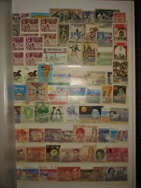 USED A4 STOCKBOOK 11/22 PAGES LOADED WITH WORLD STAMPS GOOD VALUE