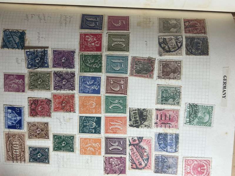 Worldwide Stamp Collection Album - 200+ hinged and used stamps. relatively full