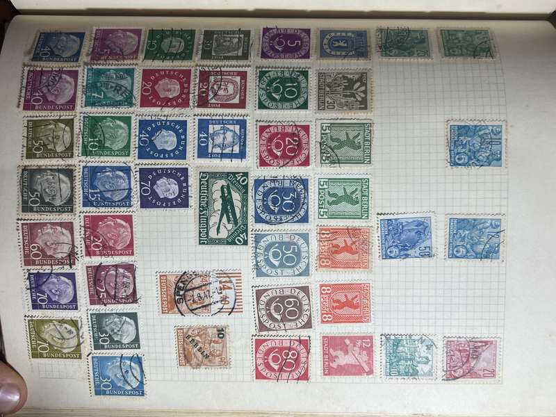 Worldwide Stamp Collection Album - 200+ hinged and used stamps. relatively full