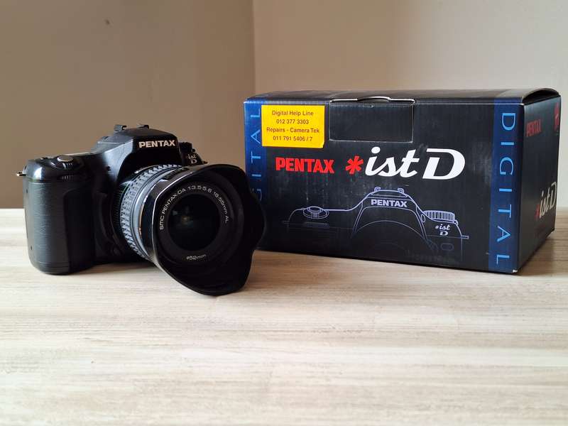 Pentax *ist D digital camera with lens
