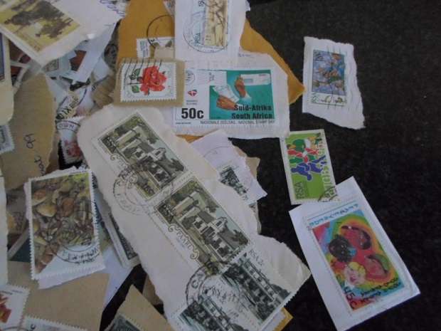 500 X USED STAMPS ON PAPER SEE PICS