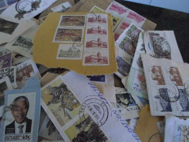 500 X USED STAMPS ON PAPER SEE PICS