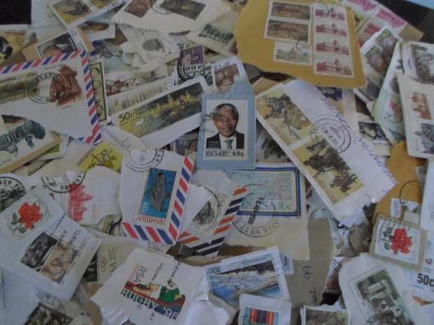 500 X USED STAMPS ON PAPER SEE PICS