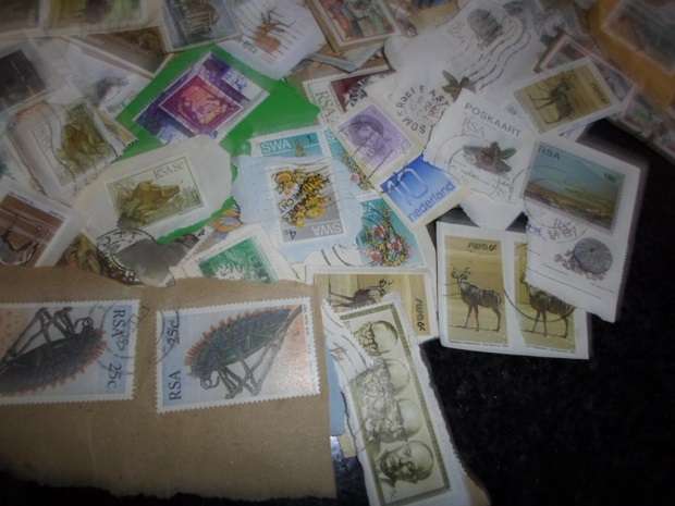 500 X USED STAMPS ON PAPER SEE PICS