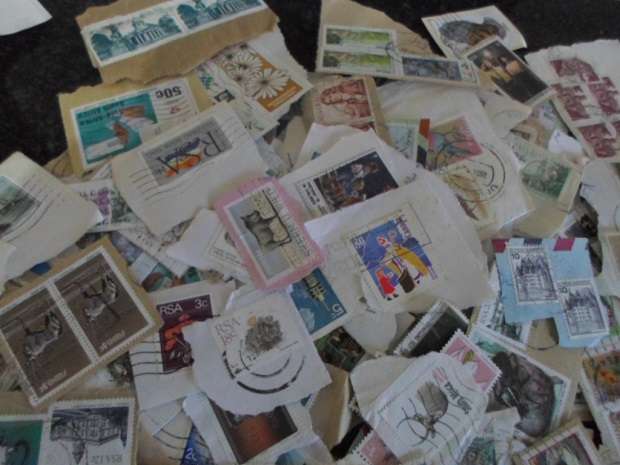 500 X USED STAMPS ON PAPER SEE PICS