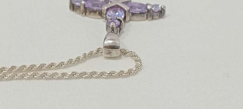 Sterling silvercross with purple cubic stones