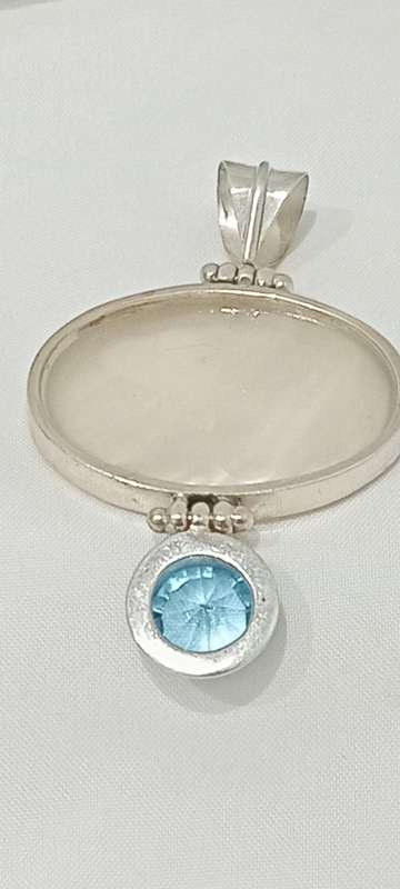 Vintage sterling silver pendant with MOP and blue stone