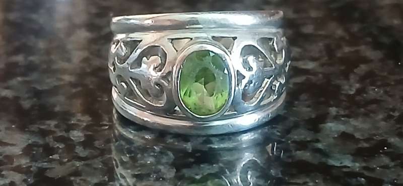 Sterling silver broad ring with green stone
