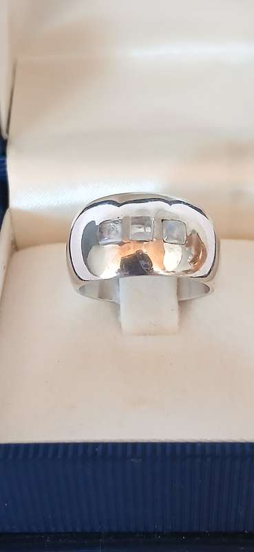 Sterling silver band with three cubic stones