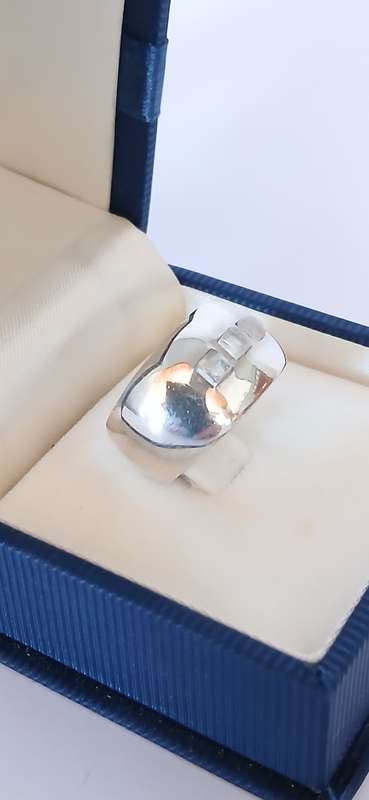 Sterling silver band with three cubic stones