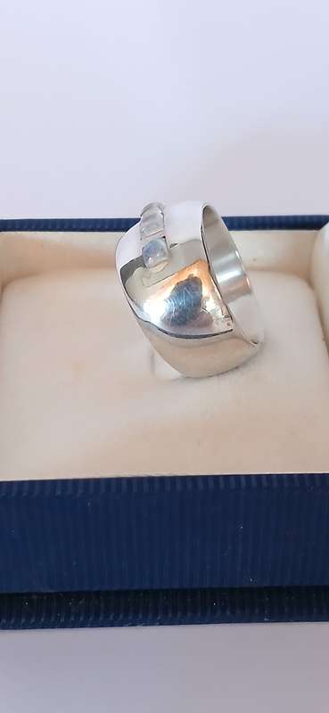 Sterling silver band with three cubic stones