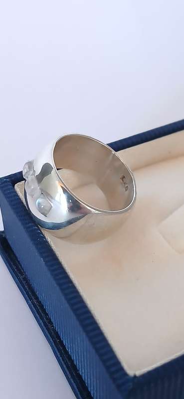 Sterling silver band with three cubic stones