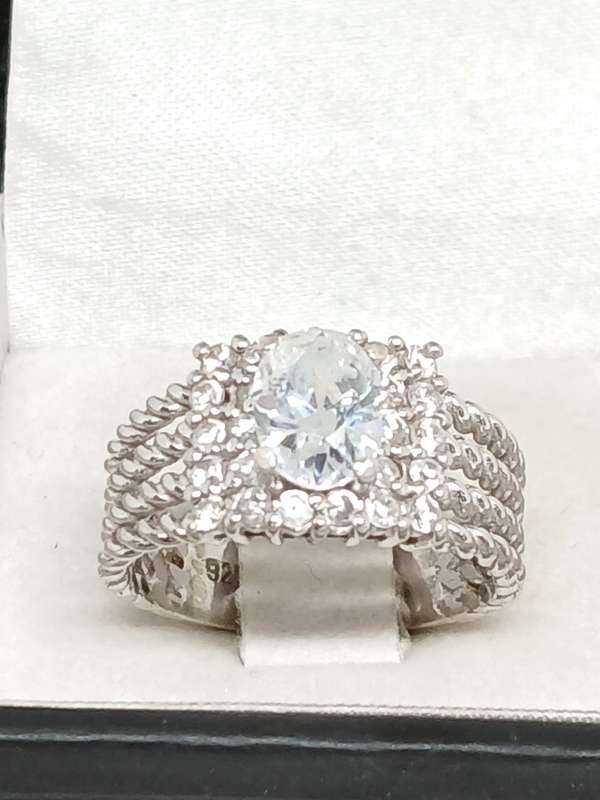 Sterling silver twist ring with cubic stones